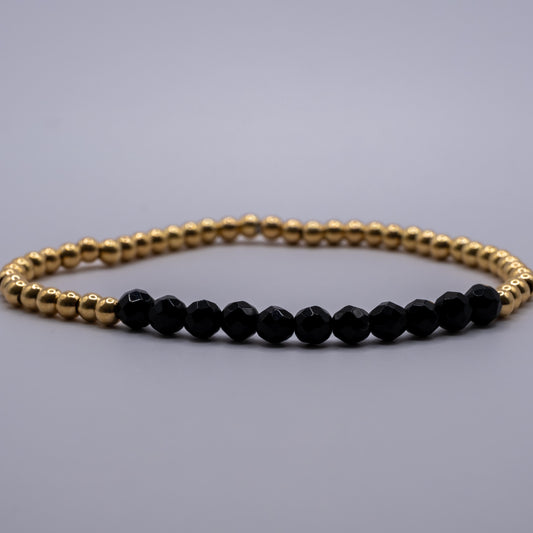 Armband Onyx - facettiert golden