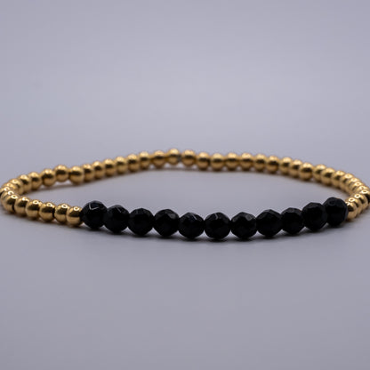 Armband Onyx - facettiert golden