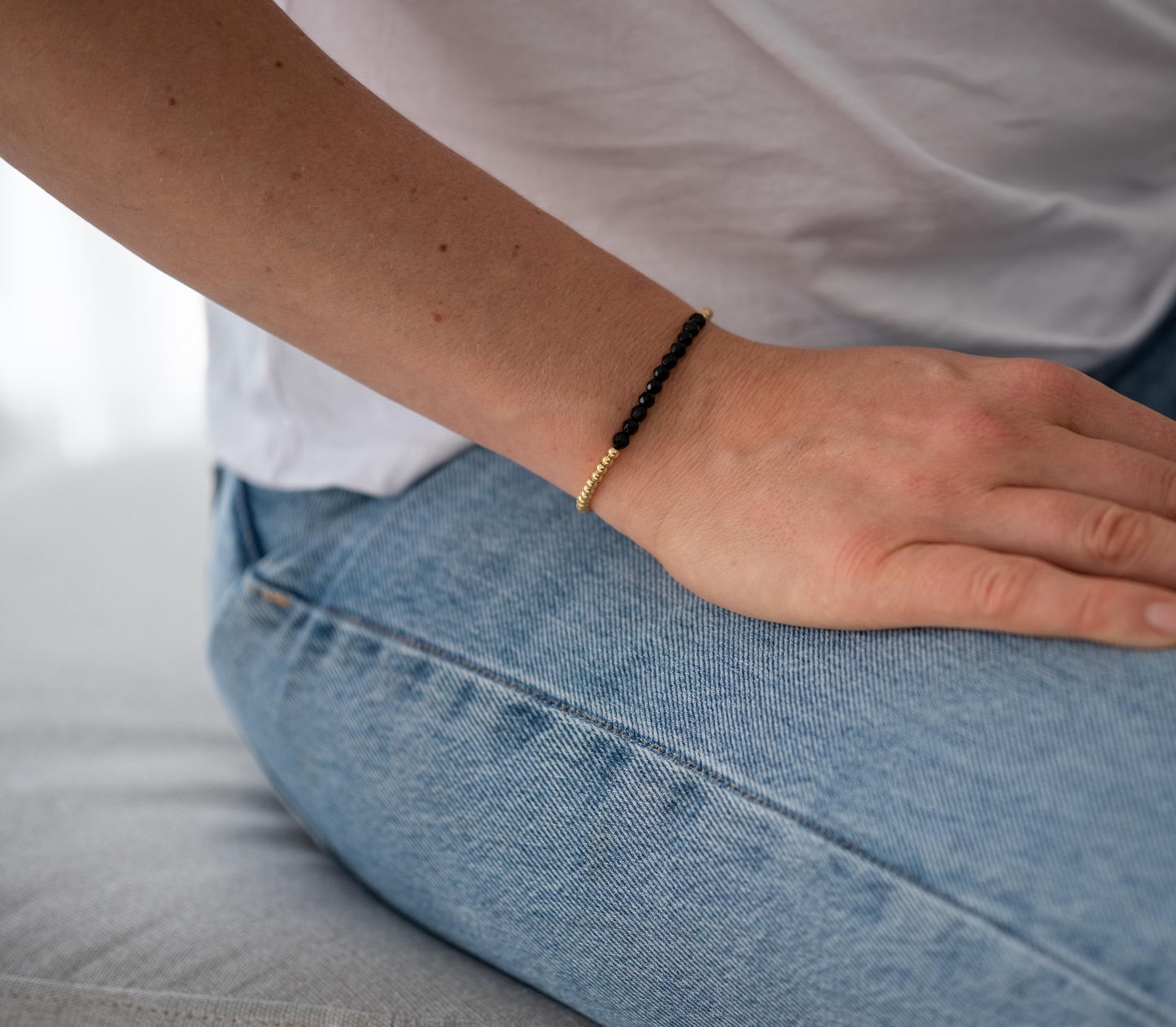 Armband Onyx - facettiert golden