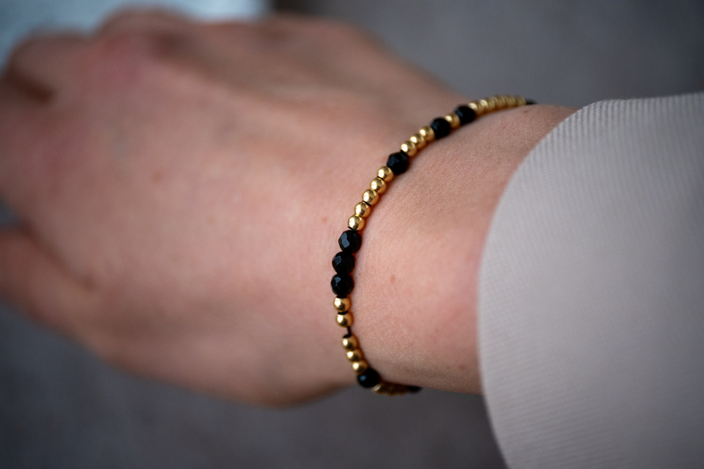 Armband Onyx - facettiert gold